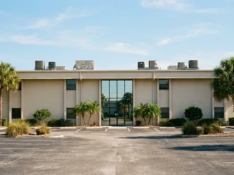 Two-story office building with rooftop AC units